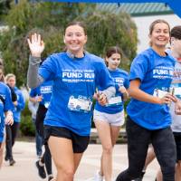 Participant waving to camera as they begin